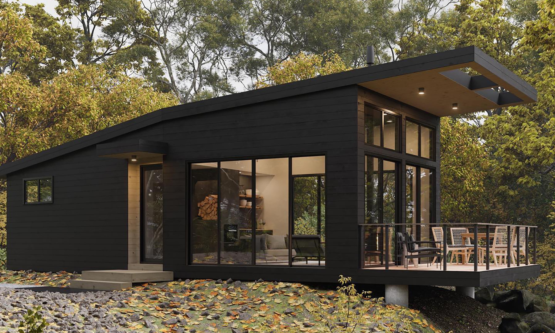 A modern and contemporary home on a hill features a sliding black patio door and many picture windows.