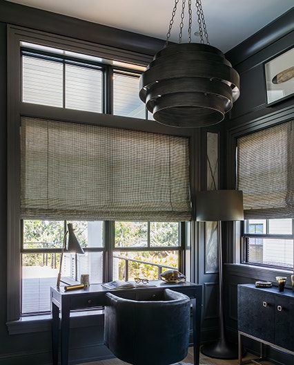 Double-hung windows featured in an office space using their screen.