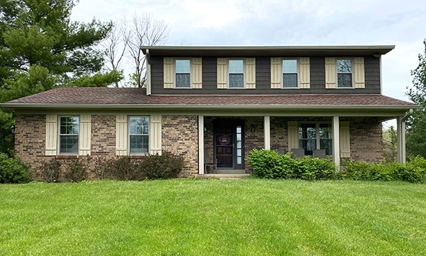 Curbside view of an Okeana home with newly installed tan Pella 250 Series Windows.