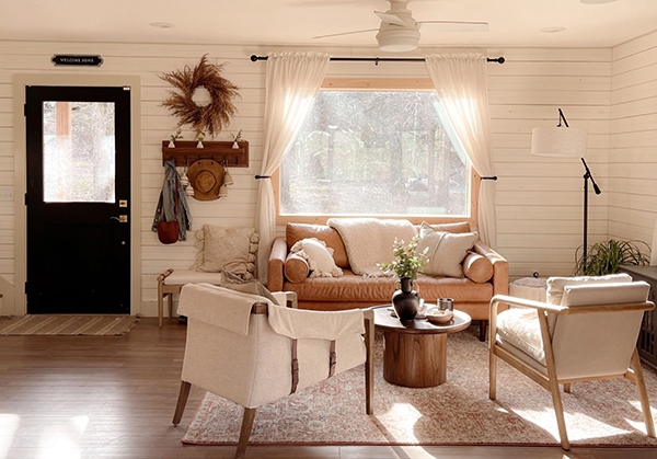 Updated Fayetteville cabin living room with newly installed windows and door.