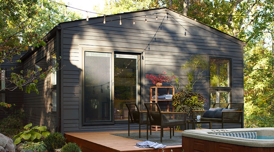 expansive black four-panel lifestyle sliding patio door
