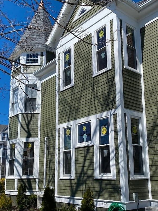 the exterior of a Boston-area home with new Pella windows installed