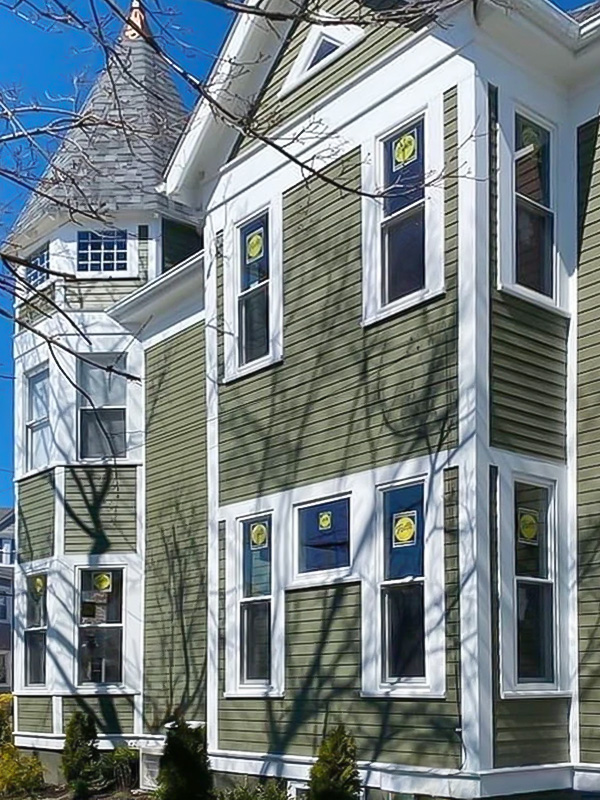 the exterior of a Boston-area home with new Pella windows installed