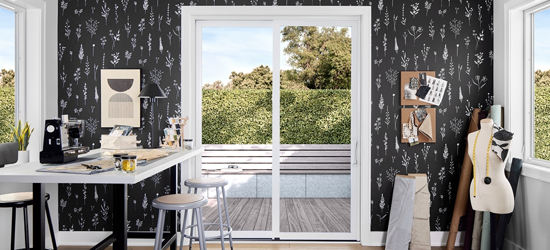 black wallpapered sewing room