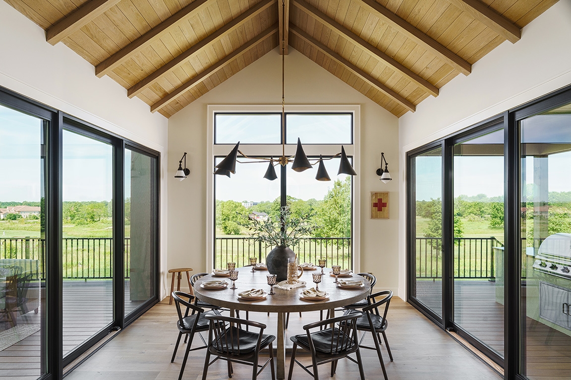Dining room in Kansas city home showcasing black fiberglass windows.