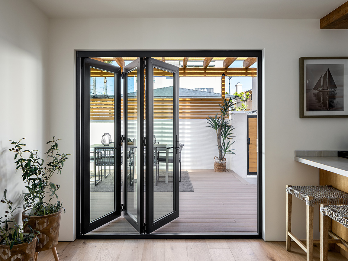 black-frame-bifold-patio-doors-modern-deck.jpg