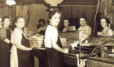 A group of women working in manufacturing during the 1940s when there were labor shortages due to the war.