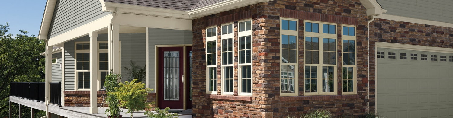 exterior shot of brick home with vinyl windows