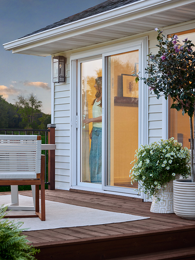 Sliding patio door opening to outdoor deck.