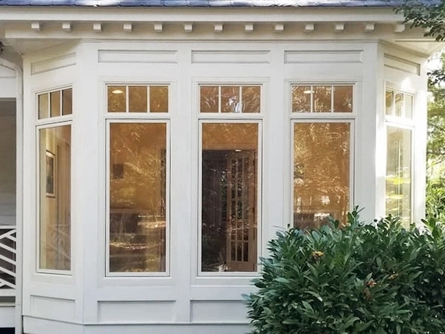 Exterior view of breakfast nook with casement windows on colonial Midlothian home