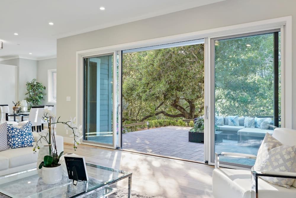 French sliding patio doors open to connect living room to outdoors