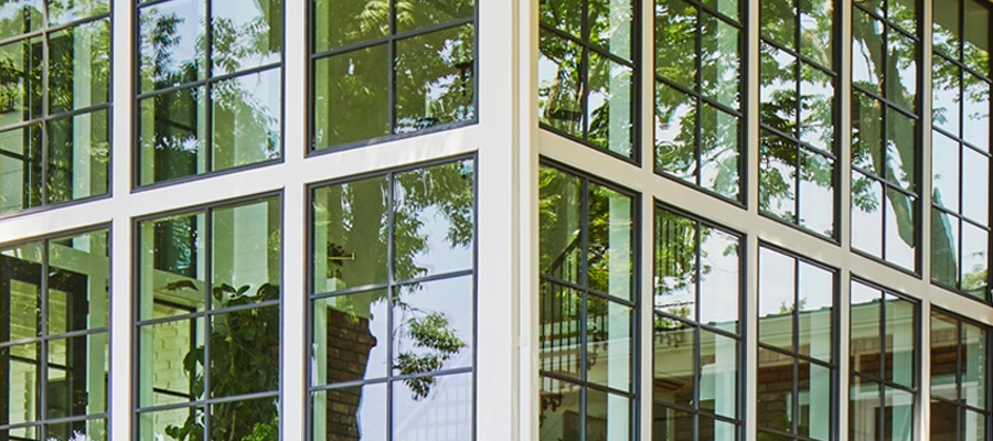 expansive reserve contemporary windows form a corner on a lake hours