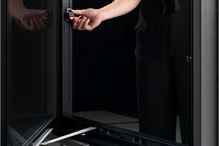 Pella's Easy Slide Operator is demonstrated on a black casement window.