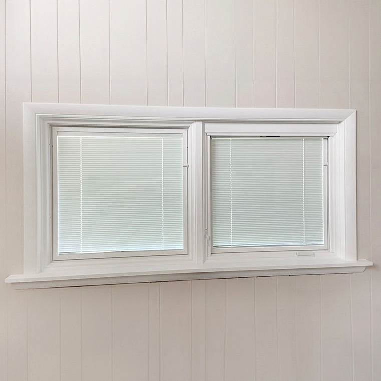 Newly installed Pella casement window with rollscreen and between-the-glass blinds on Tulsa home.