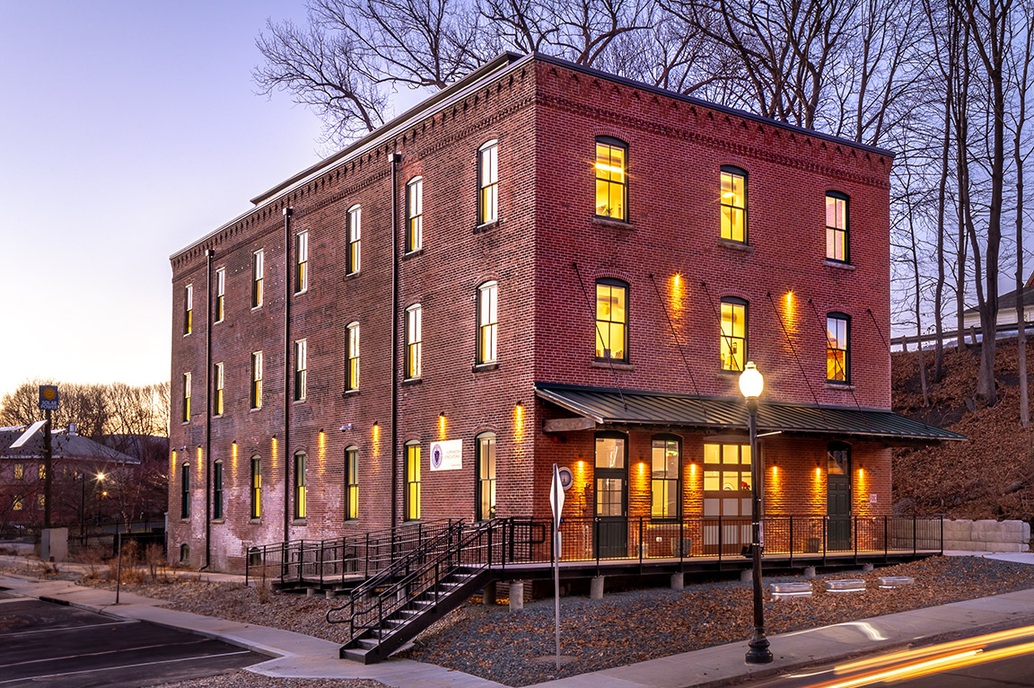 Curbside view of Abercrombie building in Greenfield with newly installed wood windows and doors.