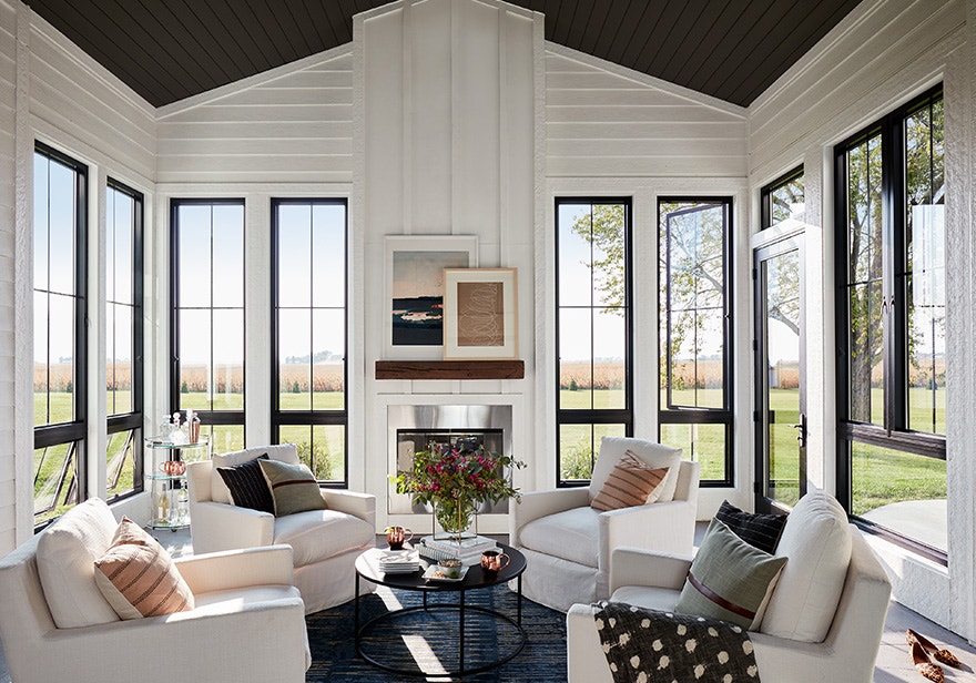 black fiberglass windows make a modern sunroom