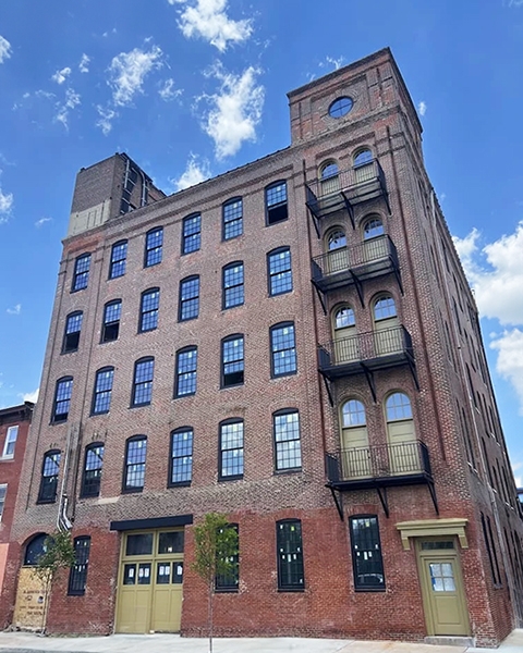 Philadelphia warehouse with new historically black wooden windows.
