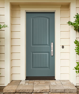 blue two panel entry door on an off-white colored home with satin nickel hardware