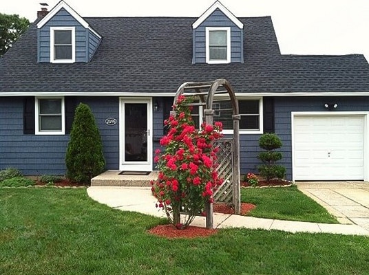 new white windows stand out against blue siding