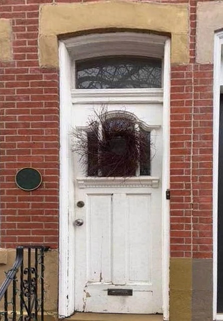 white front entry door needing replaced