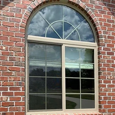  A sliding window with an arched transom is ready for a remodel.