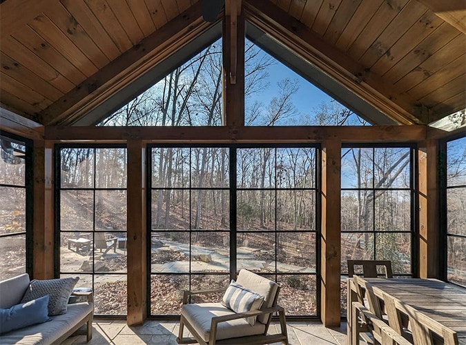 sunroom with floor-to-ceiling windows, including triangle transoms