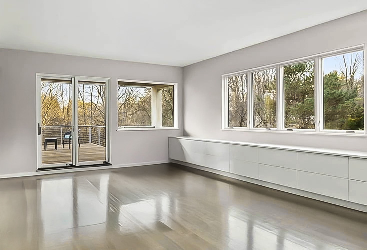 Boston home renovation with casement windows, hinged french doors and minimalist furniture.