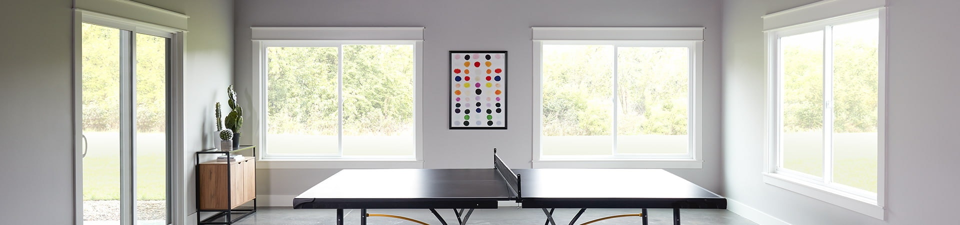 250 series sliding windows in a family rec room ping pong table