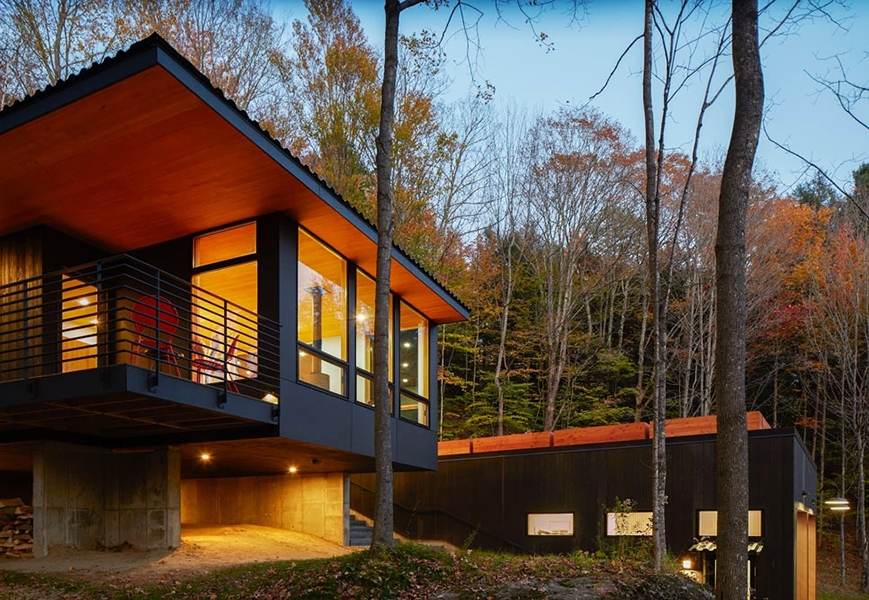 Exterior view of modern Mad River guesthouse with newly installed Pella windows and patio doors.