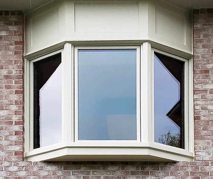 Exterior view of Pella kitchen bay window in South Hills home. 