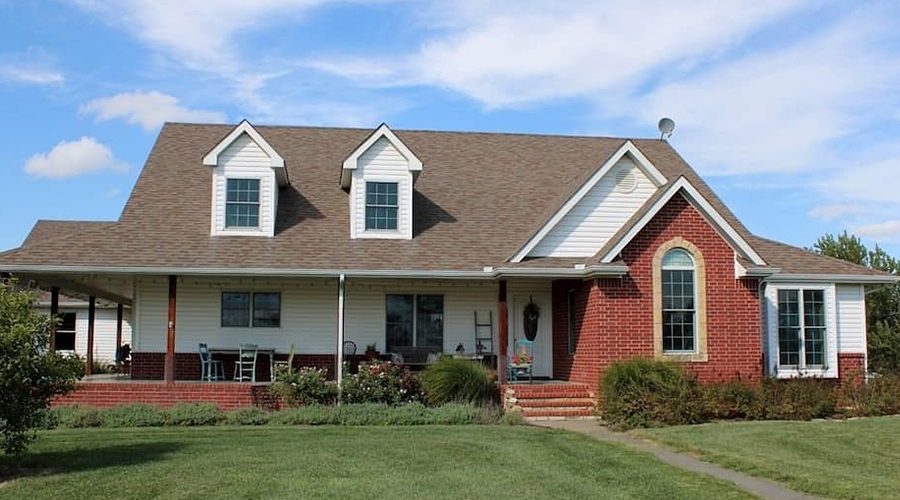 a Kansas-area home remodel with a simple front porch and brick accents.