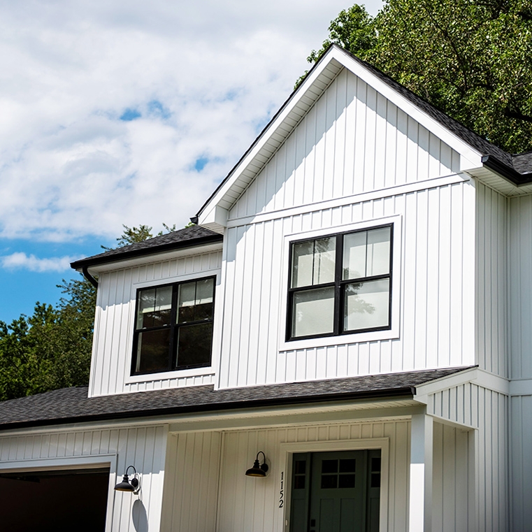 Front exterior windows with dual-colored frames in Annapolis home. 