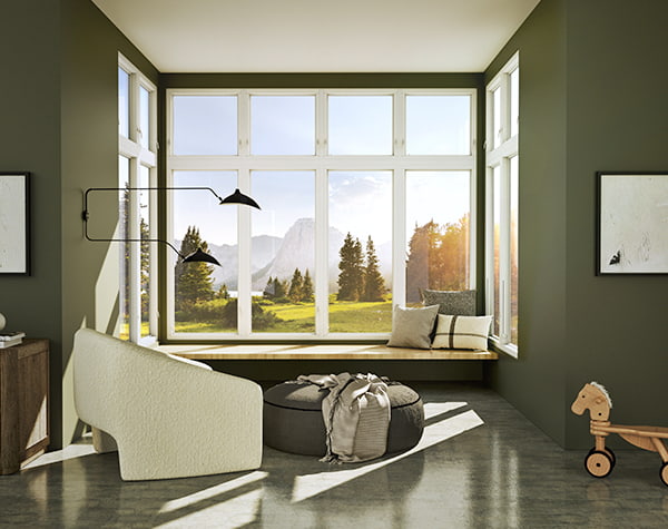 A window seat underneath a corner unit of casement windows