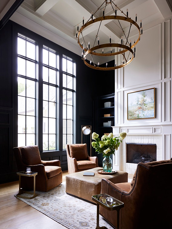 Formal living room with victorian windows featuring a traditional grille pattern.