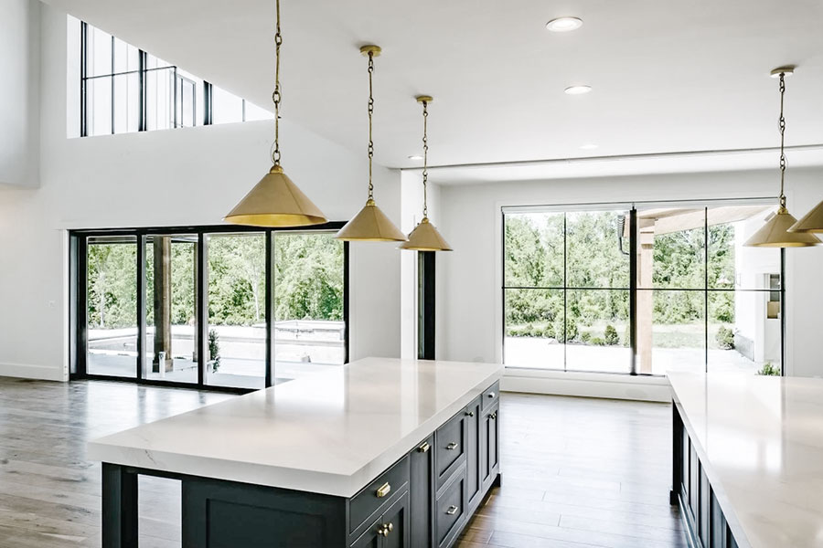 Contemporary black windows and doors accentuate modern farmhouse kitchen aesthetics. 