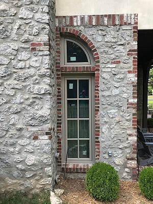 an new casement window with an arched transom on a Tulsa home exterior