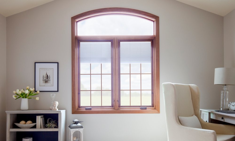 white home office with two wood casement windows with transom overhead