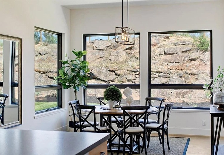 Black Windows Provide Crisp Contrast To Modern Dining Room Dining room in Santa Rosa home with newly installed Pella contemporary wood windows.