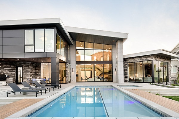 contemporary gray home with floor-to-ceiling windows