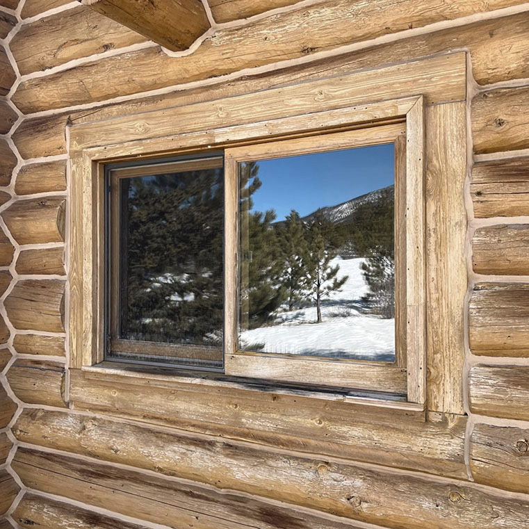 A cabin wooden window, showcasing a before sliding window.