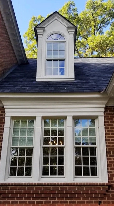 Close up of colonial home with newly installed Pella windows.