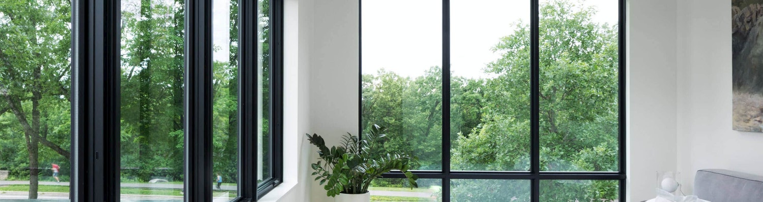 black-trimmed windows on two sides of a room