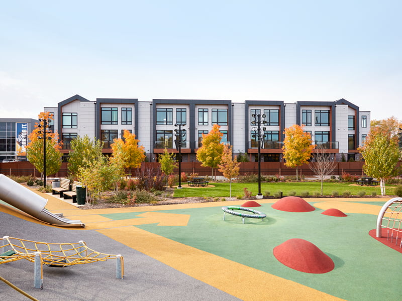titletown multi-family apartments with a gaming courtyard in front