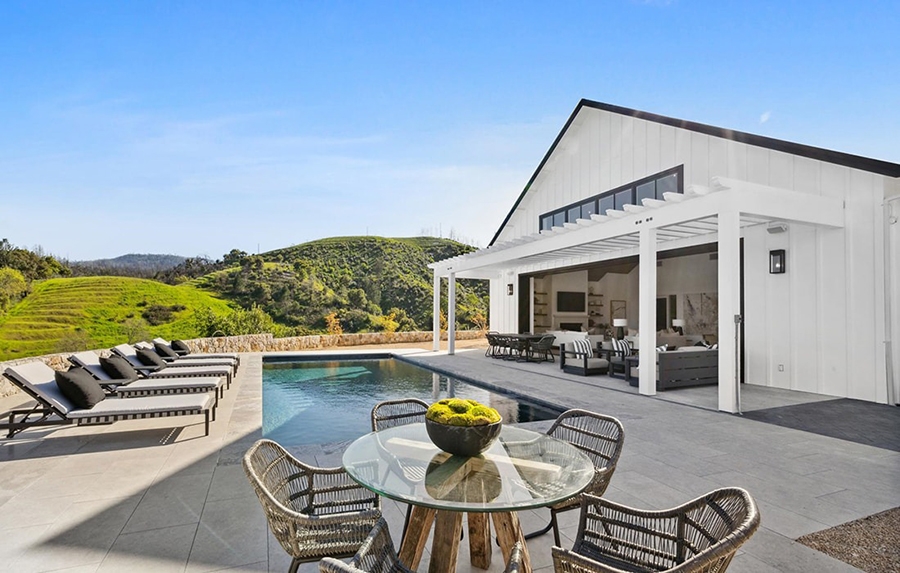 Backyard of Napa Valley farmhouse with pool and newly installed Pella doors.