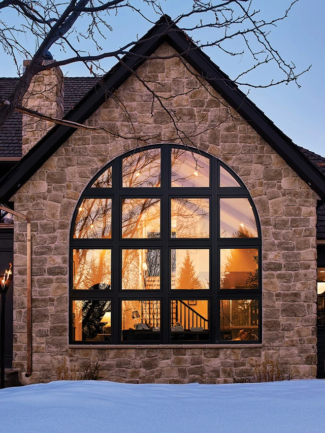 black-arched-window-stone-house.png