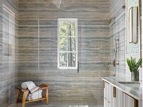 stonework on the walls of a walk-in contemporary shower