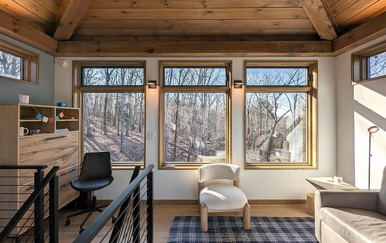 home office with wood floors, wood-paneled ceiling, and three large wood casement windows