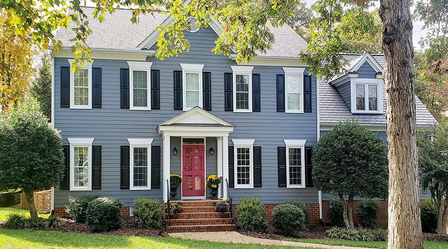Curbside photo of a Richmond Colonial home with newly installed Pella 250 Series vinyl double-hung windows.