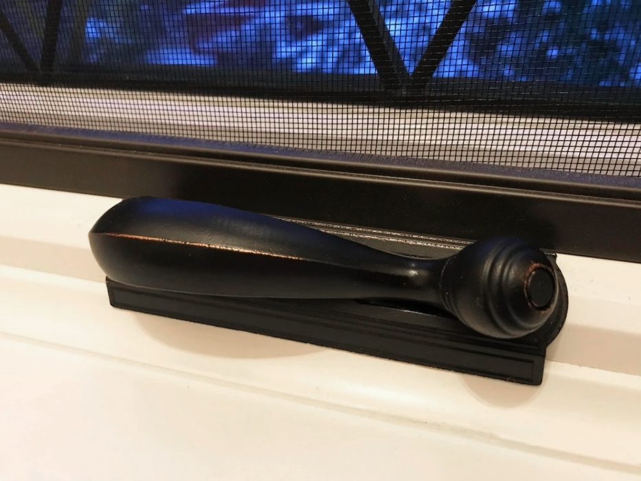 Closeup of custom hardware for diamond grid window.