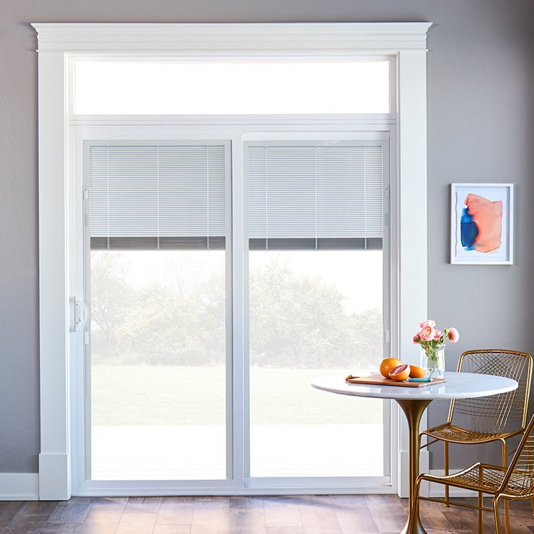 a two-panel white sliding patio door with blinds-between-the-glass